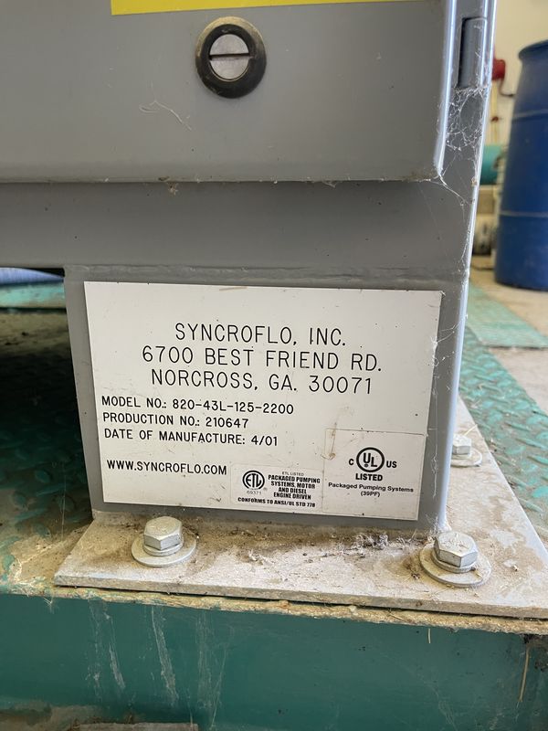 Pump station nameplate reading SyncroFlo, Inc., Norcross, GA, Model No. 820-43L-125-2200, date of manufacture 4/01